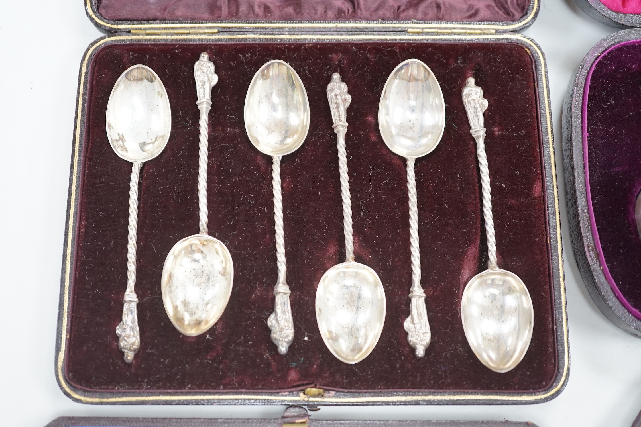 Four cased sets of silver cutlery including apostle spoons and christening sets.